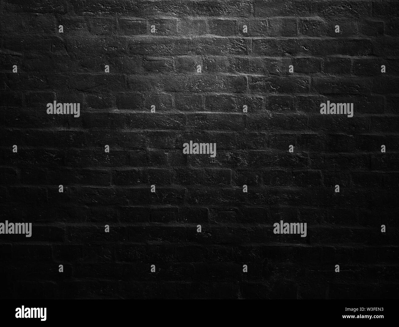 old black brick wall as background Stock Photo - Alamy