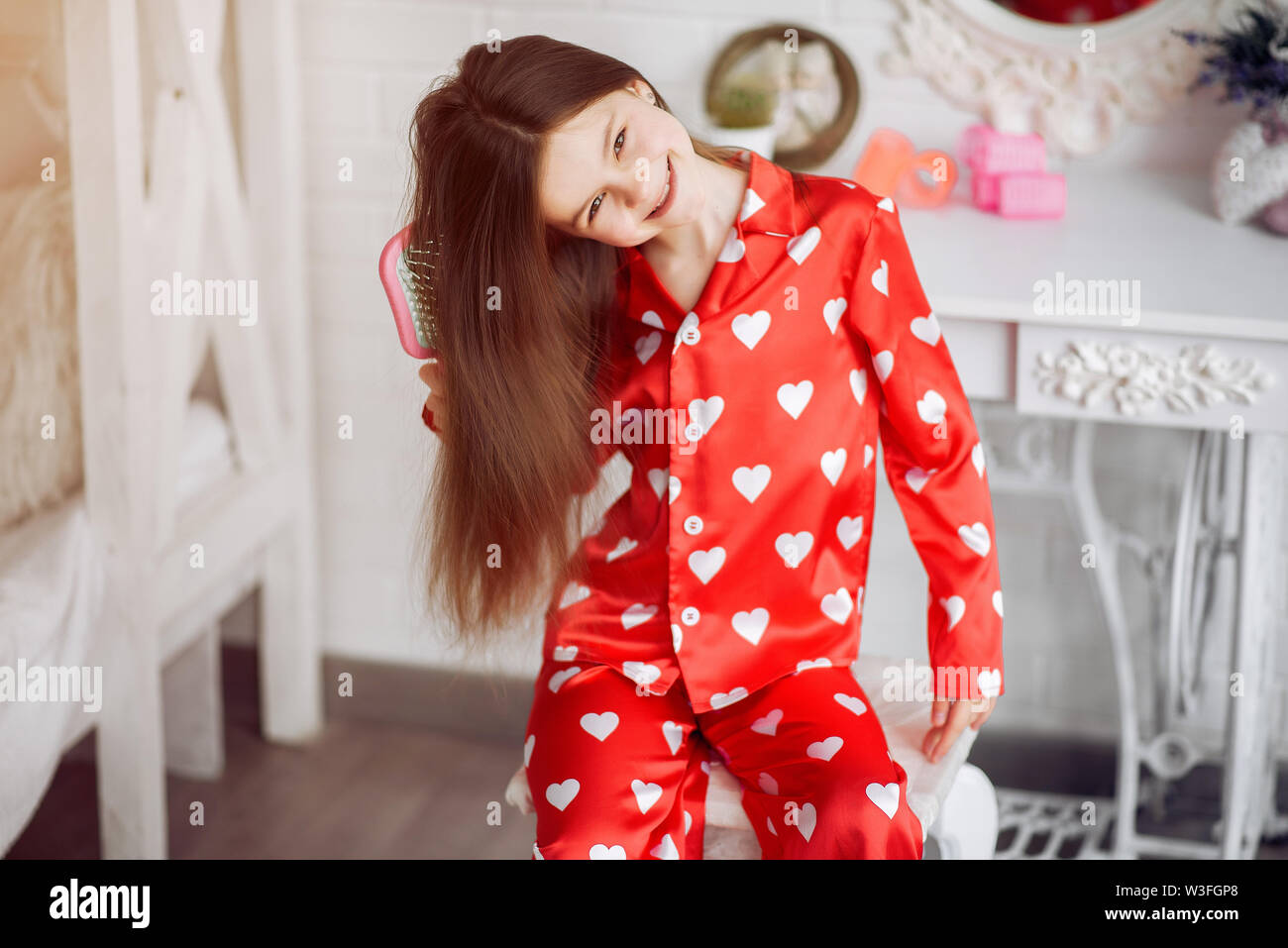 Cute little girl at home in a pajamas Stock Photo - Alamy