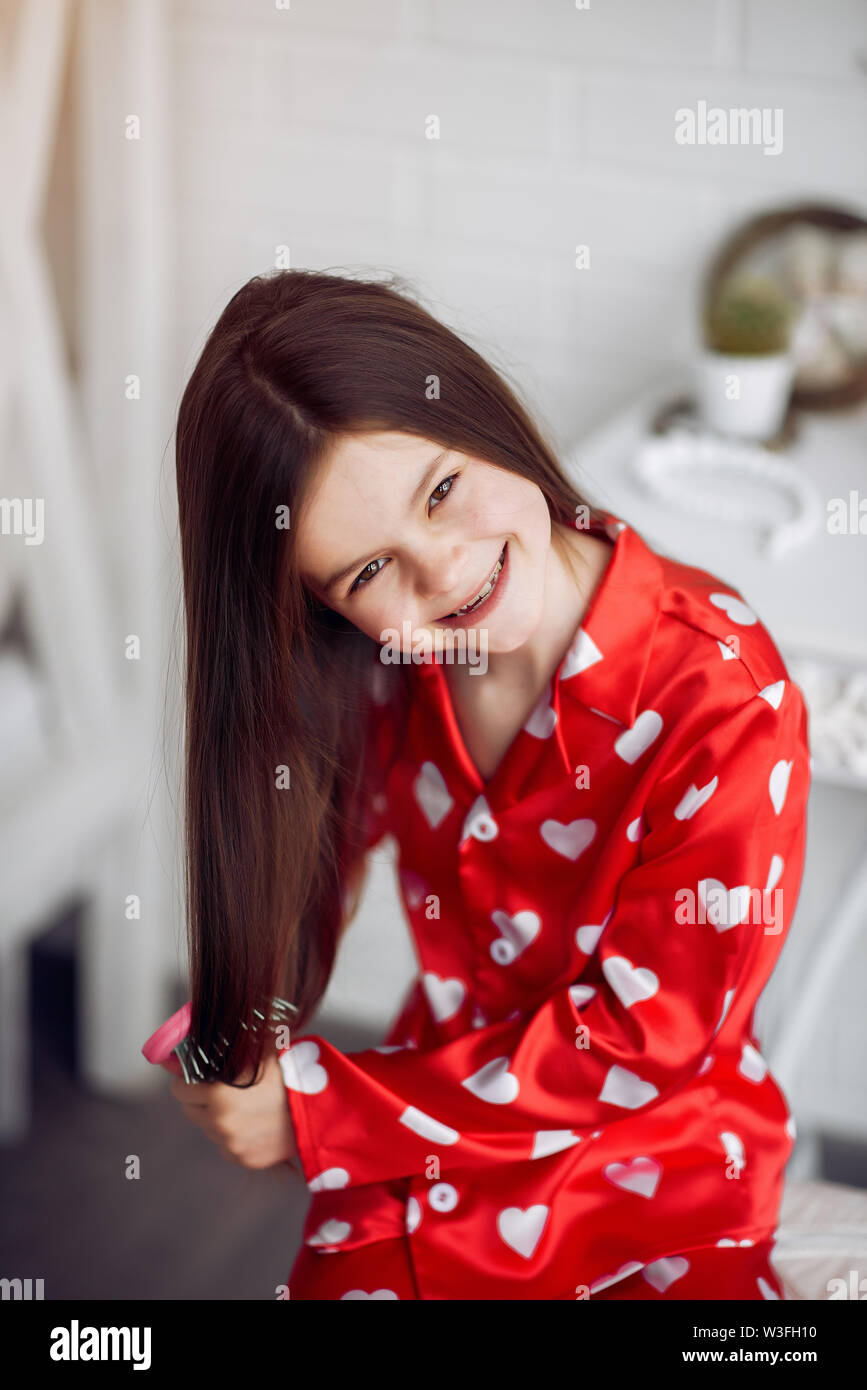 Cute little girl at home in a pajamas Stock Photo - Alamy