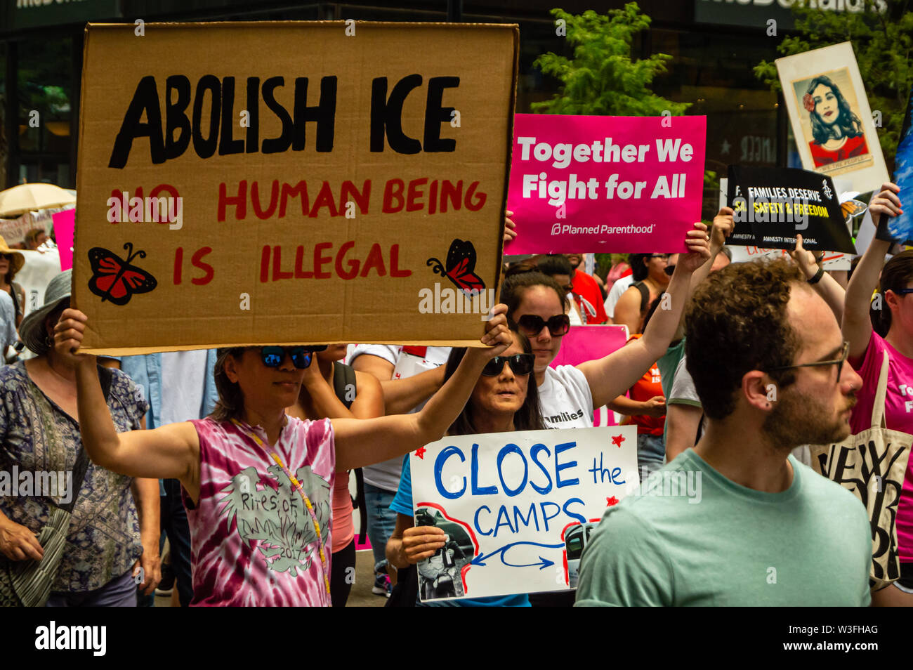 Downtown, Chicago-July 13, 2019: Protest against ICE and Customs and Border Patrol Detention Centers. Sign reads 'Abolish ICE, No Human Being is Illeg Stock Photo