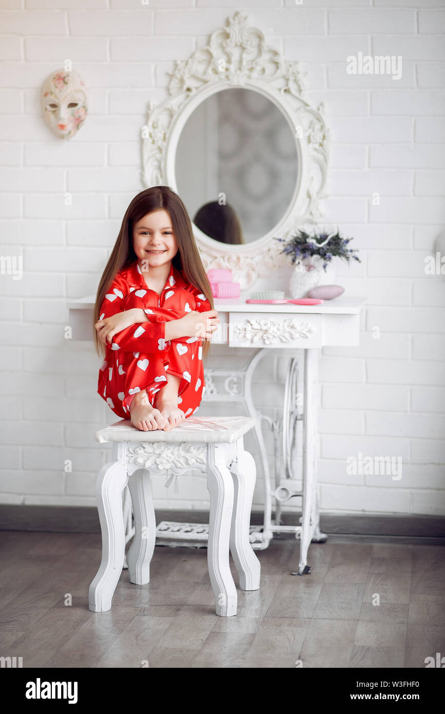 Cute little girl at home in a pajamas Stock Photo - Alamy