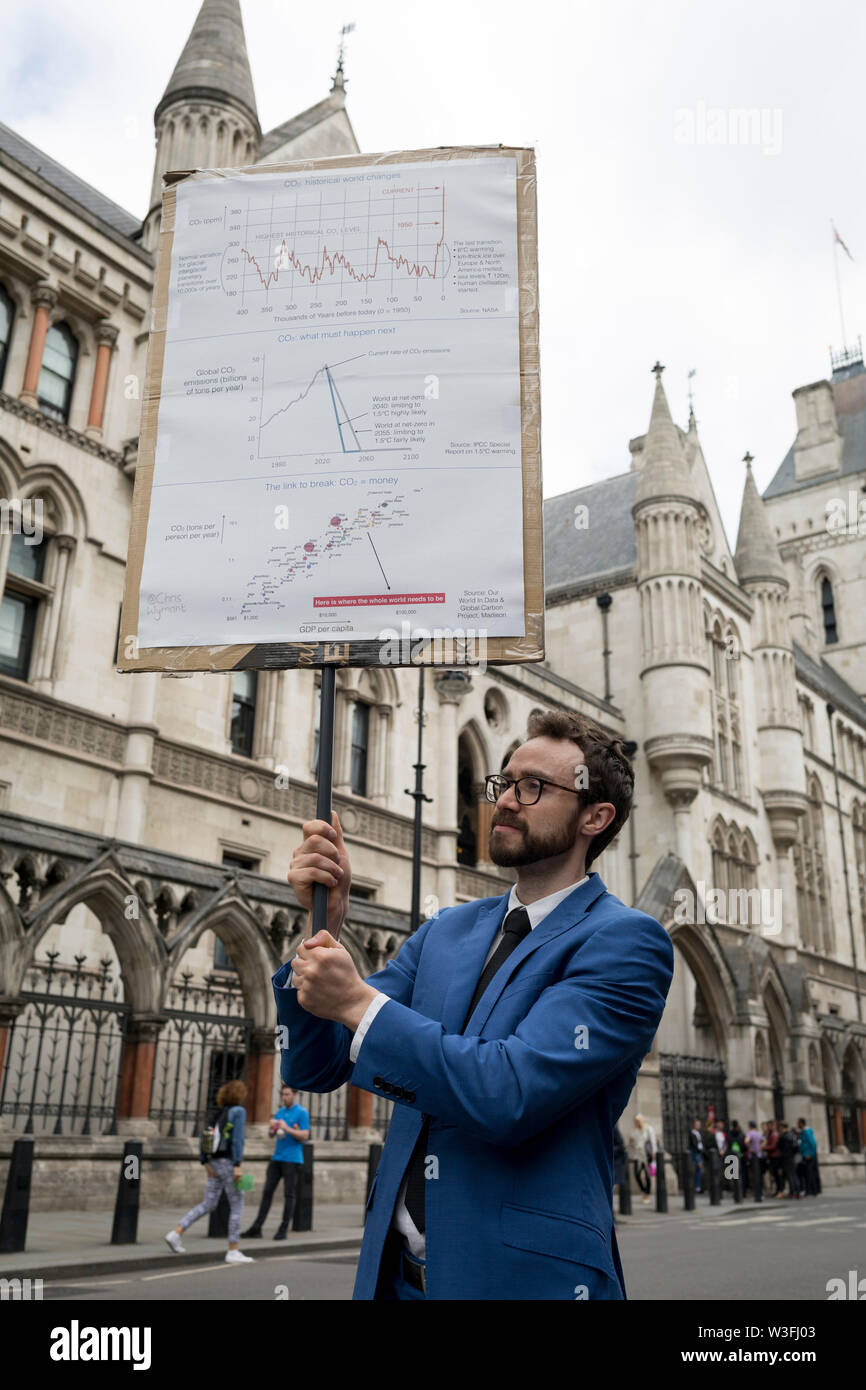 Environmental and climate change protesters block Fleet Street on the first day of a week-long country-wide protests using using five boats to stop traffic in Cardiff, Glasgow, Bristol, Leeds, and London, on 15th July 2019, in London, England. The group is calling on the government to declare a climate emergency, saying it was beginning a five-day 'summer uprising' and that 'Ecocide' ought to be a criminal offence in law. Stock Photo