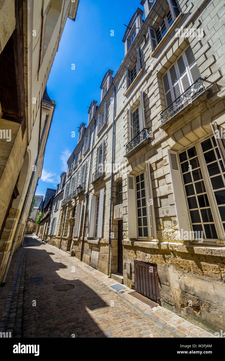 Stone buildings in narrow street of old Tours, France. Stock Photo