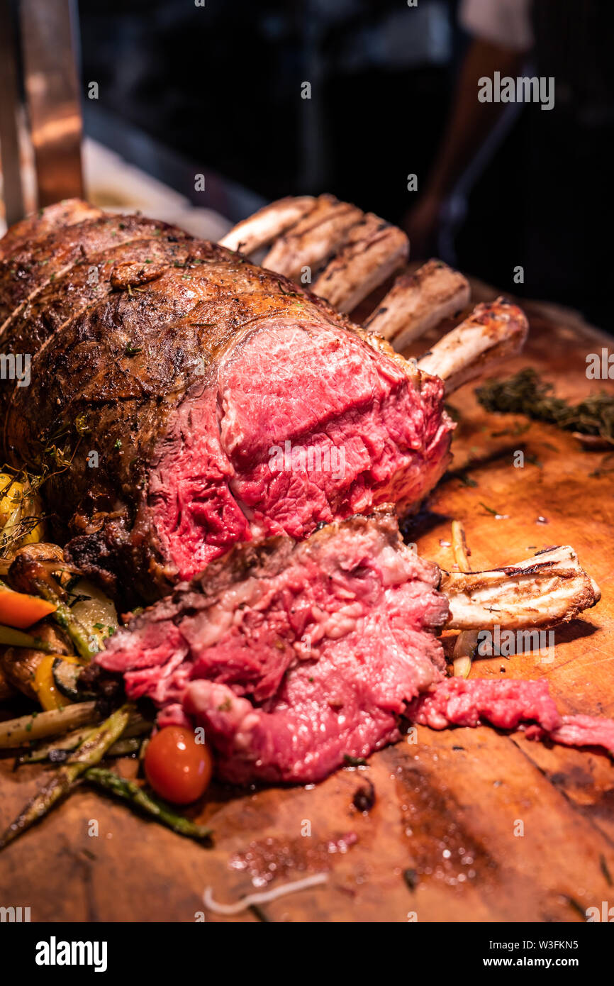 Wagyu beef roast prime rib, Carving food Stock Photo Alamy