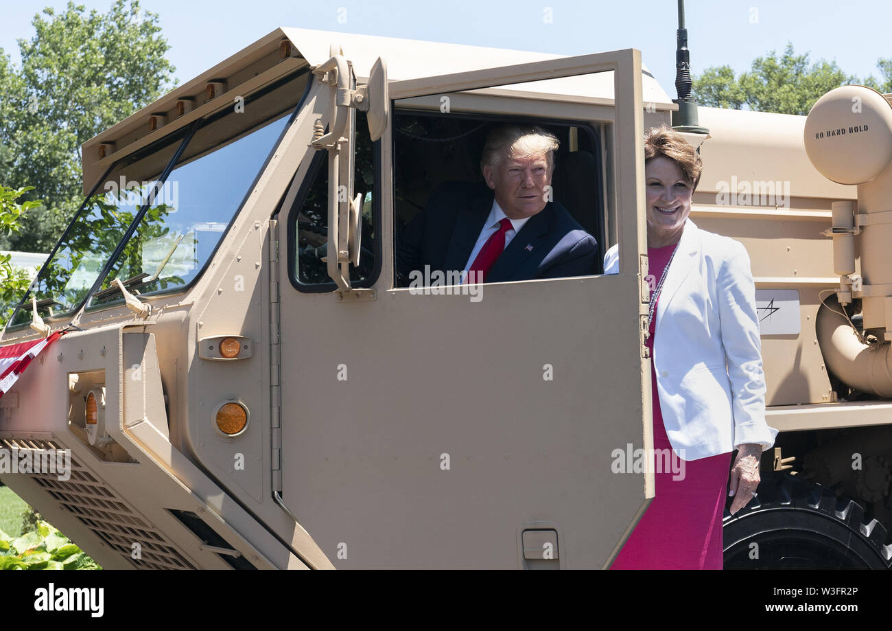 Washington, District of Columbia, USA. 15th July, 2019. July 15, 2019 - Washington, DC, United States: United States President Donald J. Trump speaks with Lockheed Martin chairwoman, president and chief executive officer Marillyn Adams Hewson aboard a THAAD (Terminal High Altitude Area Defense) missile launcher on display at the 3rd Annual Made in America Product Showcase at the White House Credit: Chris Kleponis/CNP/ZUMA Wire/Alamy Live News Stock Photo