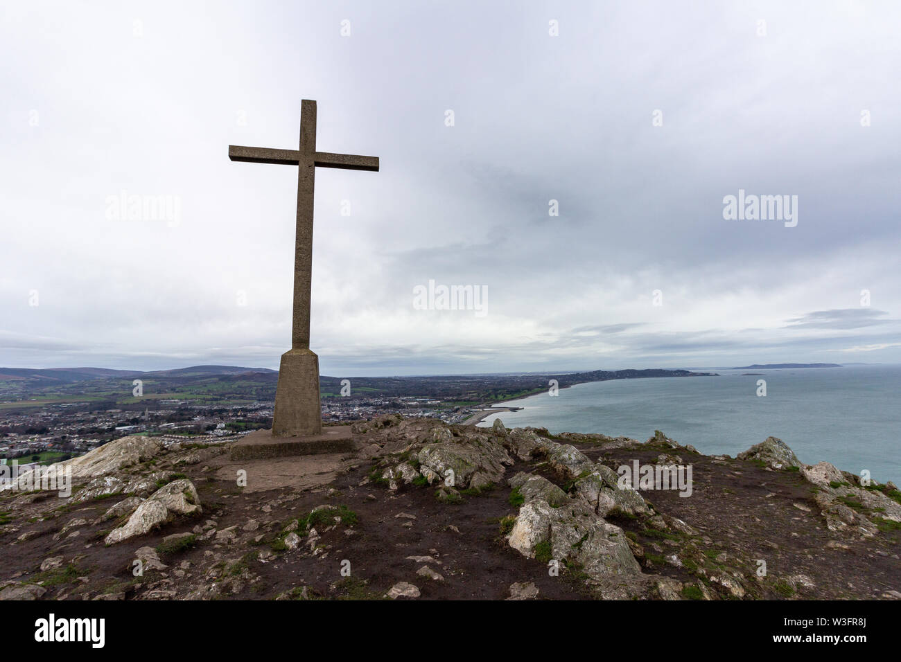 At the highest point on Bray Head is a cross overlooking the Irish coastline toward Dalkey Island Stock Photo
