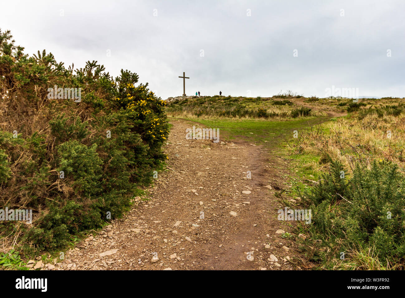 A rocky path leading toward the cross located high atop Bray Head in County Wicklow, Ireland Stock Photo
