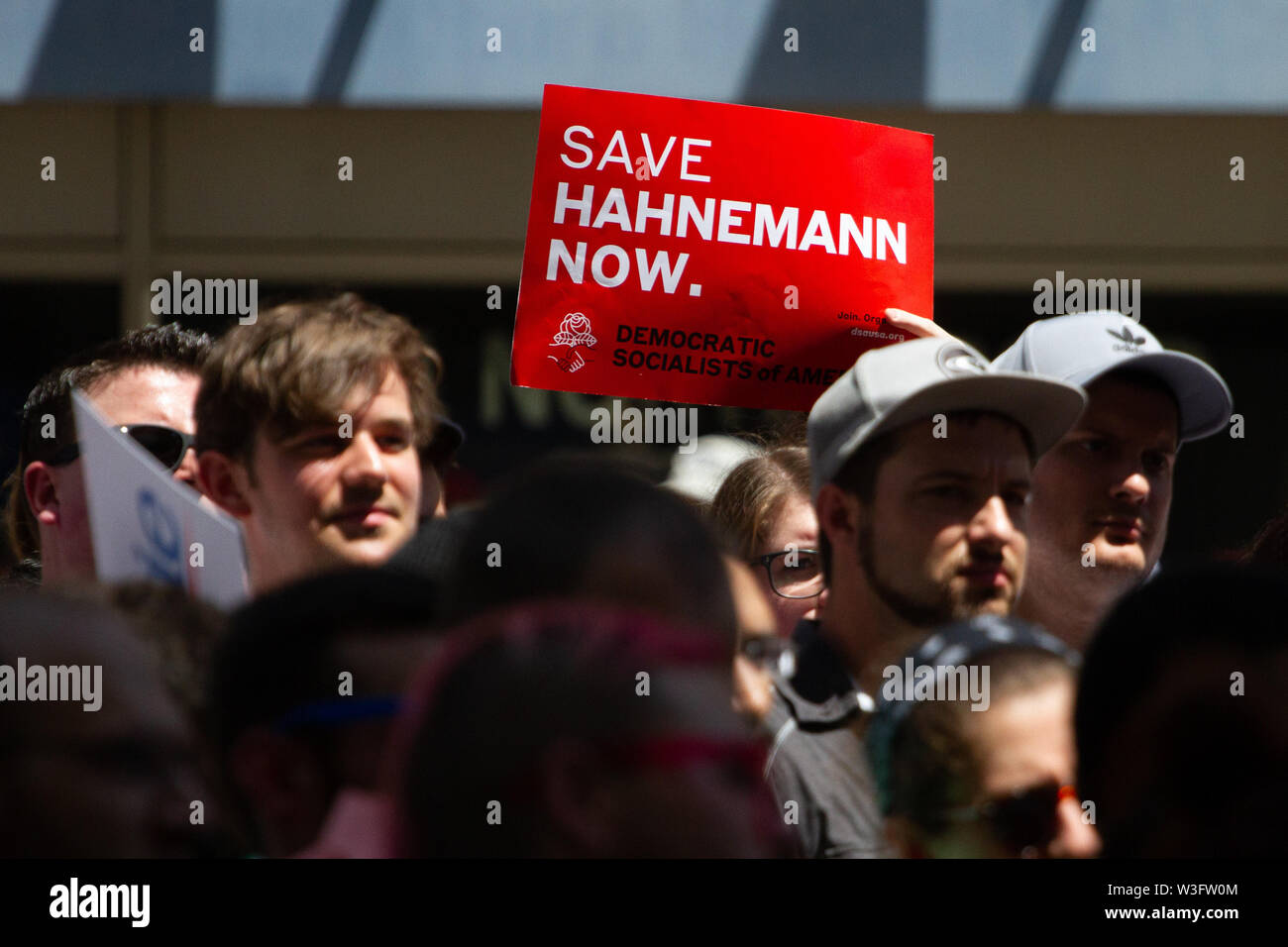 Philadelphia, Pennsylvania, USA. 15th July, 2019. July 15, 2019 - A crowd of hundreds gathers to protest the closure of Hahnemann University Hospital in Philadelphia, PA, July 15, 2019. Hahnemann, a busy urban healthcare center, is facing imminent closure after being acquired by a hedge fund that is looking to raze the building and turn the land into rental or retail properties. (Credit Image: © Michael CandeloriZUMA Wire) Credit: ZUMA Press, Inc./Alamy Live News Stock Photo