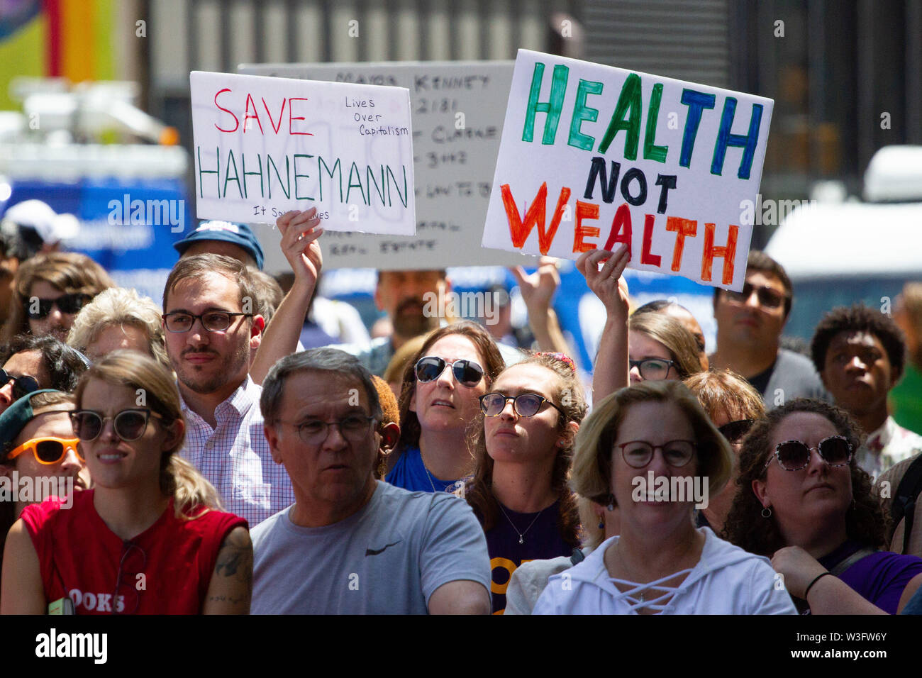 Philadelphia, Pennsylvania, USA. 15th July, 2019. A crowd of hundreds gathers to protest the closure of Hahnemann University Hospital in Philadelphia, PA, July 15, 2019. Hahnemann, a busy urban healthcare center, is facing imminent closure after being acquired by a hedge fund that is looking to raze the building and turn the land into rental or retail properties. 15th July, 2019. Credit: Michael Candelori/ZUMA Wire/Alamy Live News Credit: ZUMA Press, Inc./Alamy Live News Stock Photo