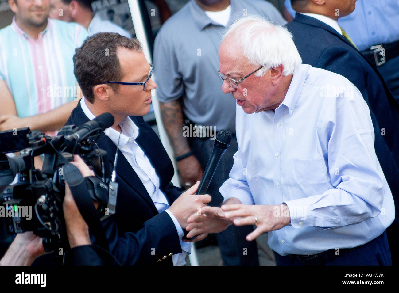 Philadelphia, Pennsylvania, USA. 15th July, 2019. Senator Bernie Sanders is interviewed following a protest against the closure of Hahnemann University Hospital in Philadelphia, PA, July 15, 2019. Hahnemann, a busy urban healthcare center, is facing imminent closure after being acquired by a hedge fund that is looking to raze the building and turn the land into rental or retail properties. 15th July, 2019. Credit: Michael Candelori/ZUMA Wire/Alamy Live News Credit: ZUMA Press, Inc./Alamy Live News Stock Photo
