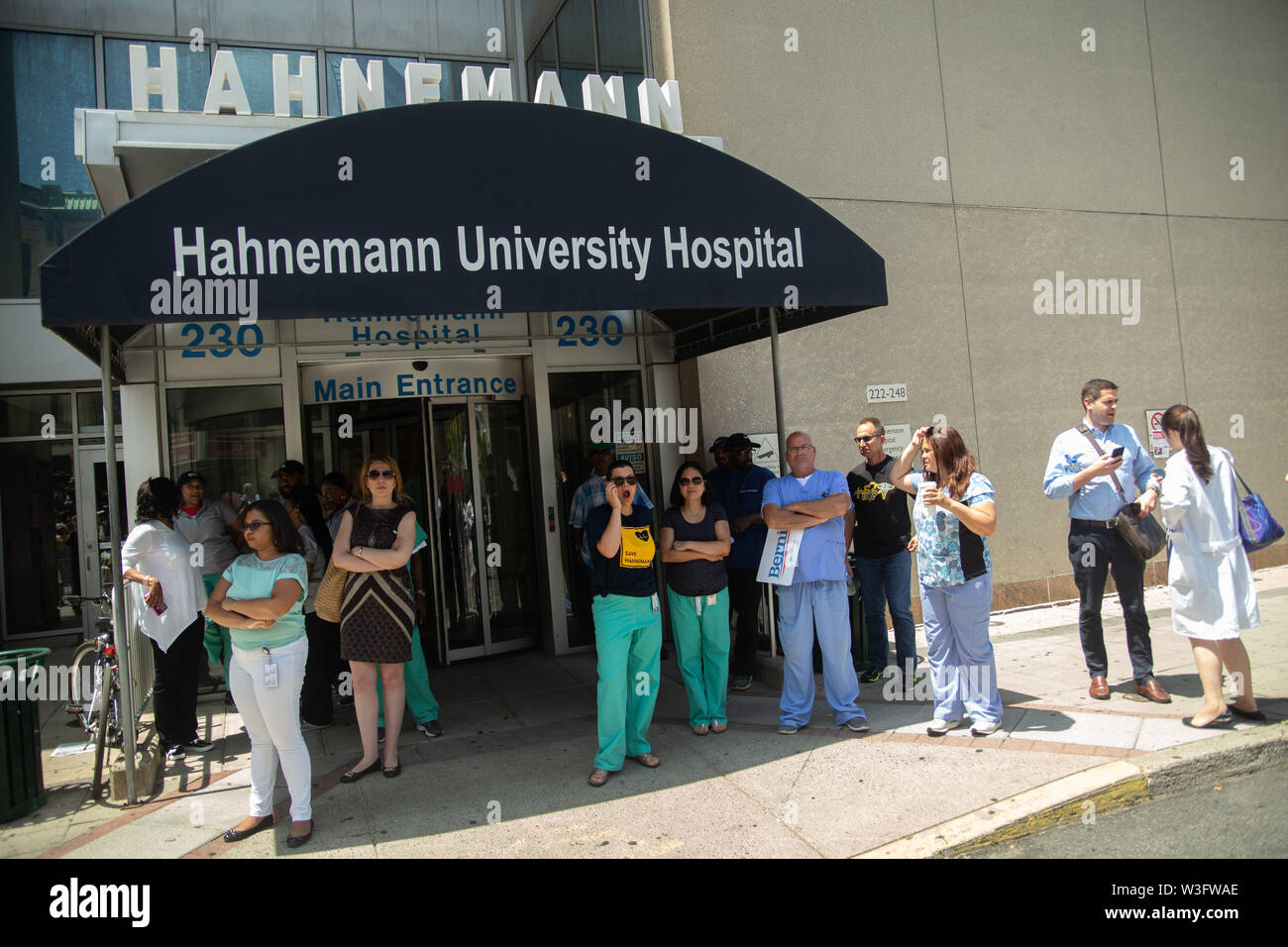 Philadelphia, Pennsylvania, USA. 15th July, 2019. A crowd of hundreds gathers to protest the closure of Hahnemann University Hospital in Philadelphia, PA, July 15, 2019. Hahnemann, a busy urban healthcare center, is facing imminent closure after being acquired by a hedge fund that is looking to raze the building and turn the land into rental or retail properties. 15th July, 2019. Credit: Michael Candelori/ZUMA Wire/Alamy Live News Credit: ZUMA Press, Inc./Alamy Live News Stock Photo