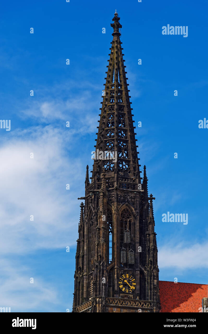 Spire of St Lambert's Church against blue sky. Muenster, Germany Stock Photo