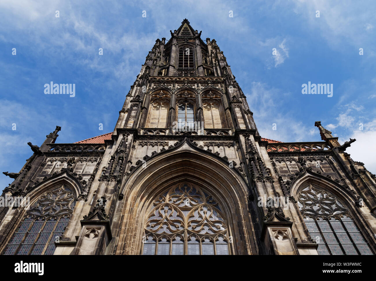 Front facade of St Lambert's Church against blue sky. Muenster, Germany Stock Photo