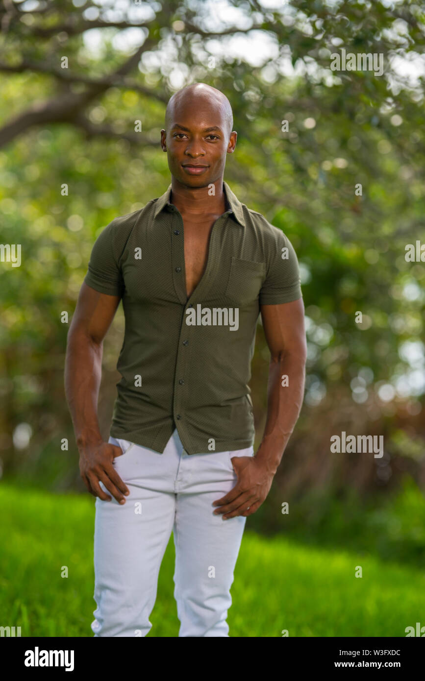 A blond, handsome man, male model, posing in an all white outfit, a futuristic  fashion concept Stock Photo - Alamy