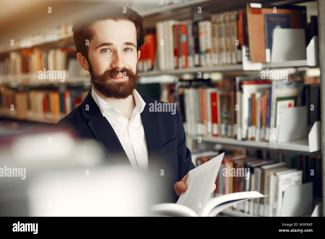 Handsome guy study at the library Stock Photo - Alamy