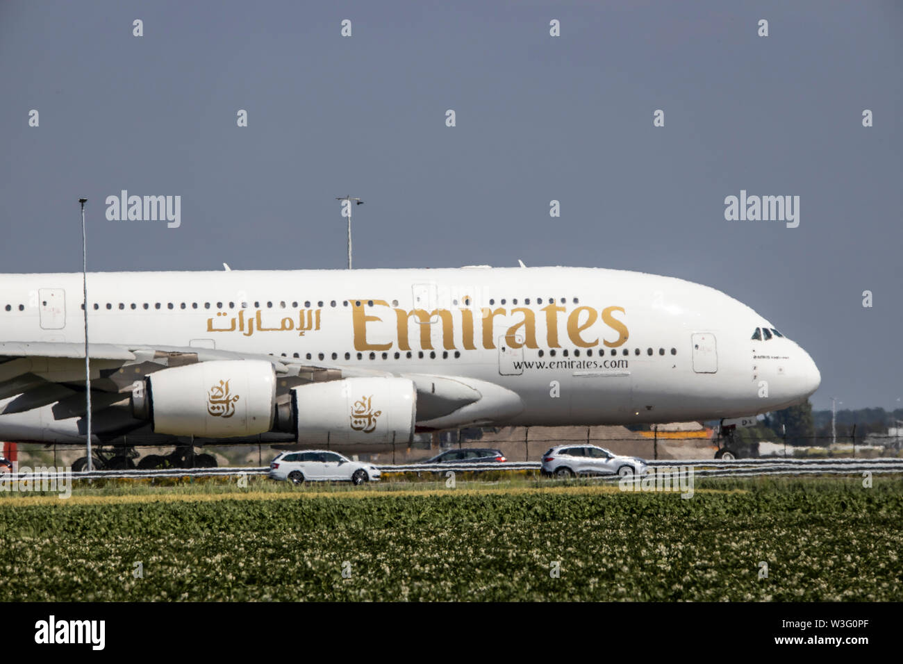 Amsterdam Schiphol Airport, Emirates Airbus A380 Jet, on the taxiway, to Polderbaan runway, along the A5 motorway, Stock Photo