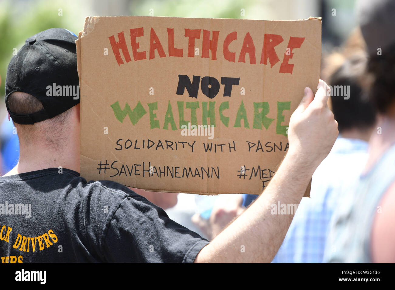 Philadelphia, Pennsylvania, USA. 15th July, 2019. Protestors rally in front of Hahnemann Hospital to protest the closing of one of Philadelphia's busiest emergency room hospitals in the city. Also, Drexel University med students train at the hospital and now must find a new hospital to continue their studies. CEO and venture capitalist Joel Freedman is closing the facility. Credit: Ricky Fitchett/ZUMA Wire/Alamy Live News Stock Photo