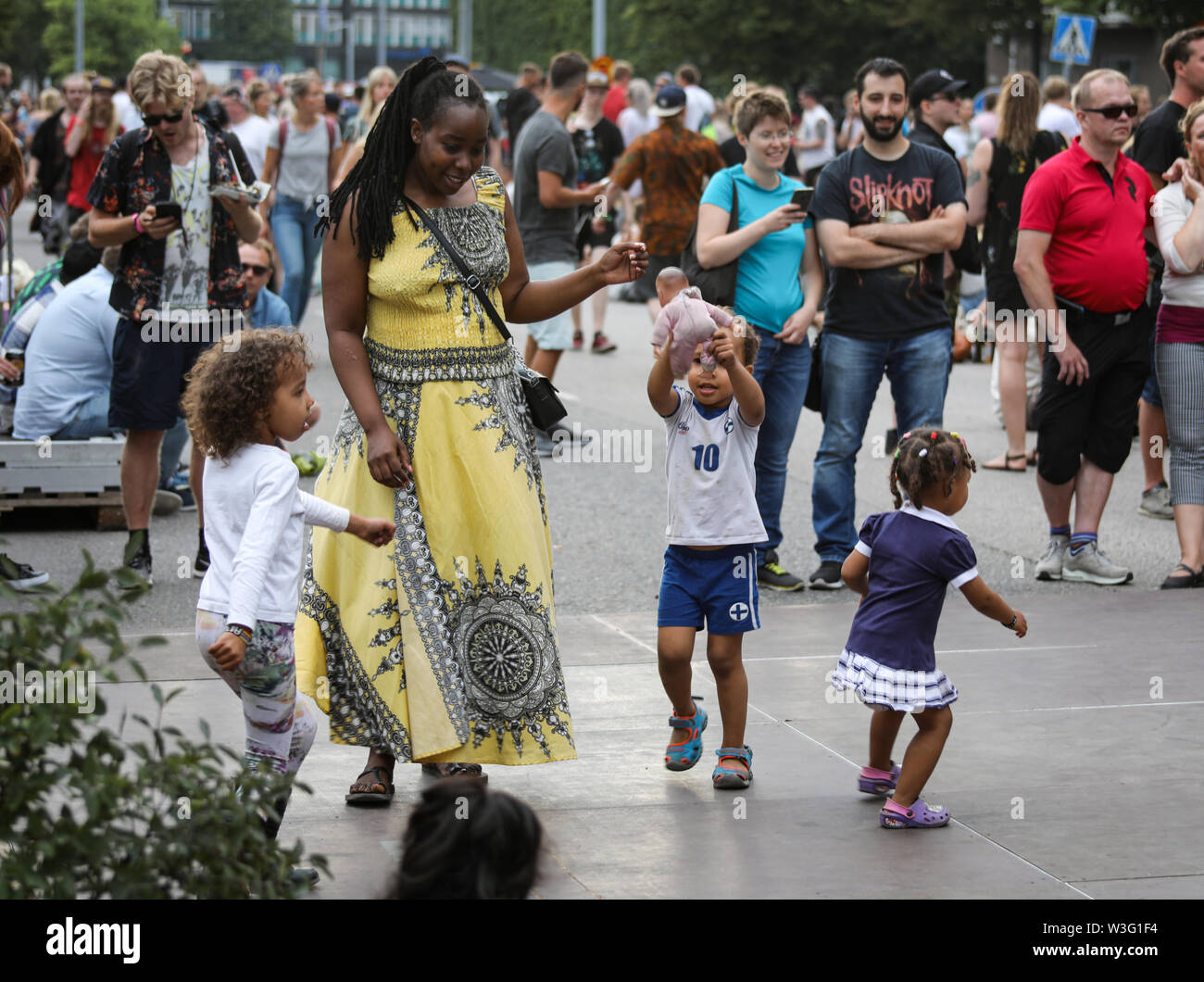 People dancing in the streets of Hakaniemi at Kallio Block Party 2018 in Helsinki, Finland Stock Photo
