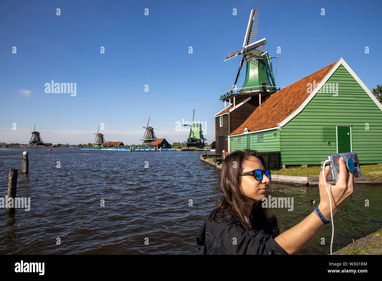 Zaanse Schans, Netherlands, historical village, open-air museum in North Holland, old windmills, workshops, farms, residential houses, tourists, souve Stock Photo