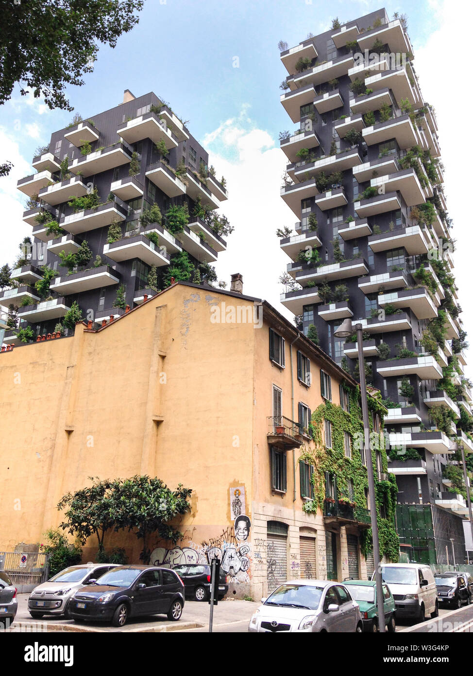 View of twins of skyscrapers and a old house in a district of Milan Stock Photo