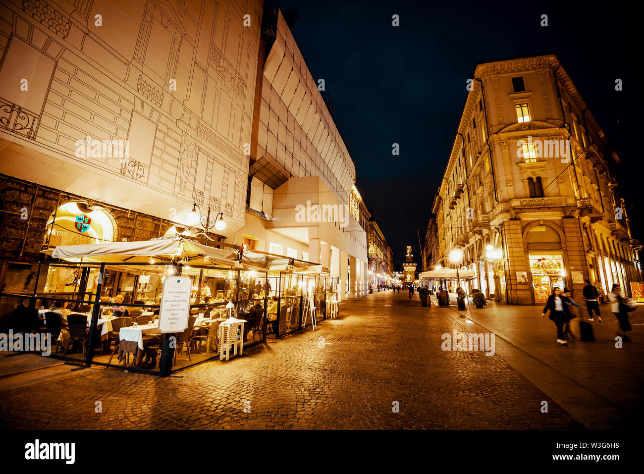 Milan, Italy - May 2nd, 2019 - Night photo of Milan city streets. Toned image Stock Photo