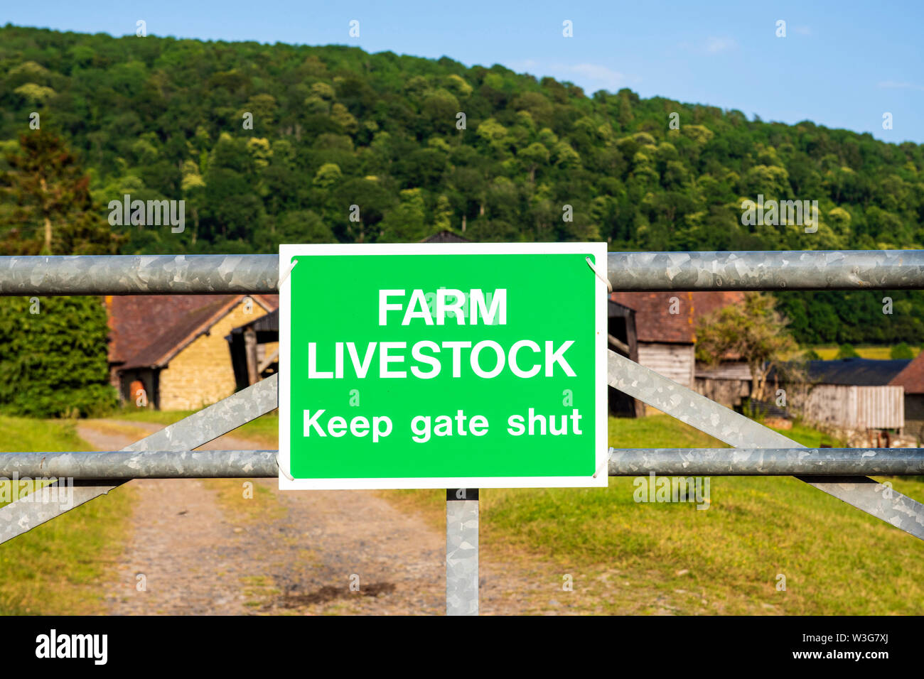 Sign - Farm livestock, keep gate shut. Stock Photo