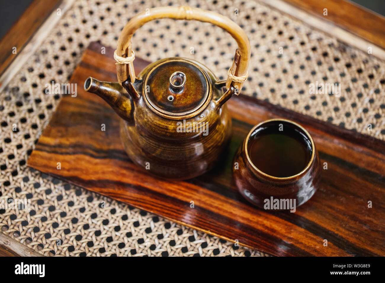 Vintage brown tea set on wooden background. Traditional tea ceremony