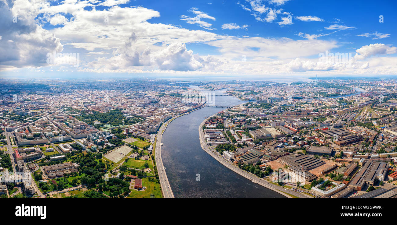 Aerial panoramic view of Neva river in Saimt Petersburg, Russia. Large wide angle cityscape with dramatic cloudy sky Stock Photo