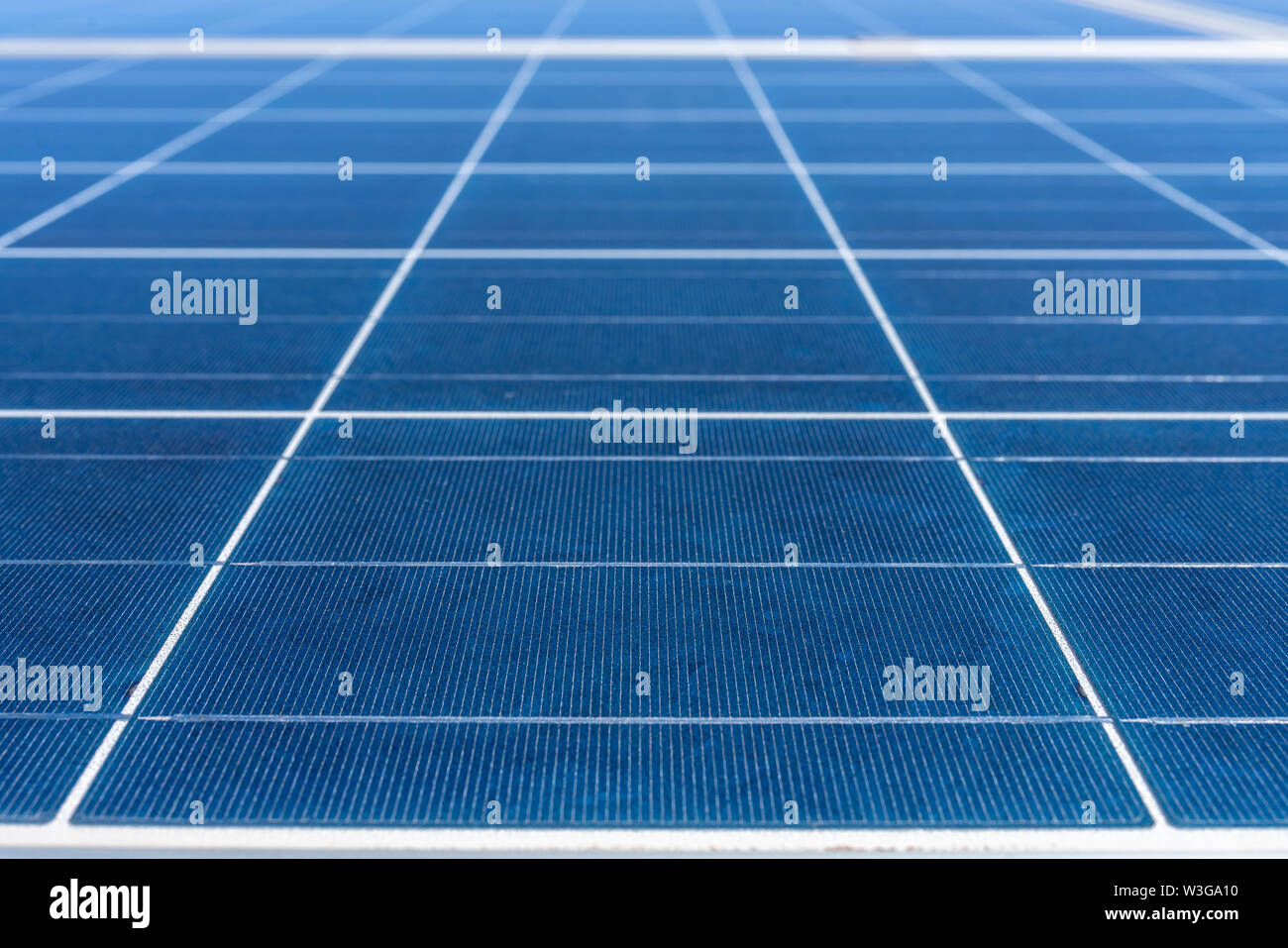 Solar Energy solar cell connections, silicon and encapsulant a nice technology blue pattern. Perspective view of Poly crystalline silicon Solar Cells Stock Photo