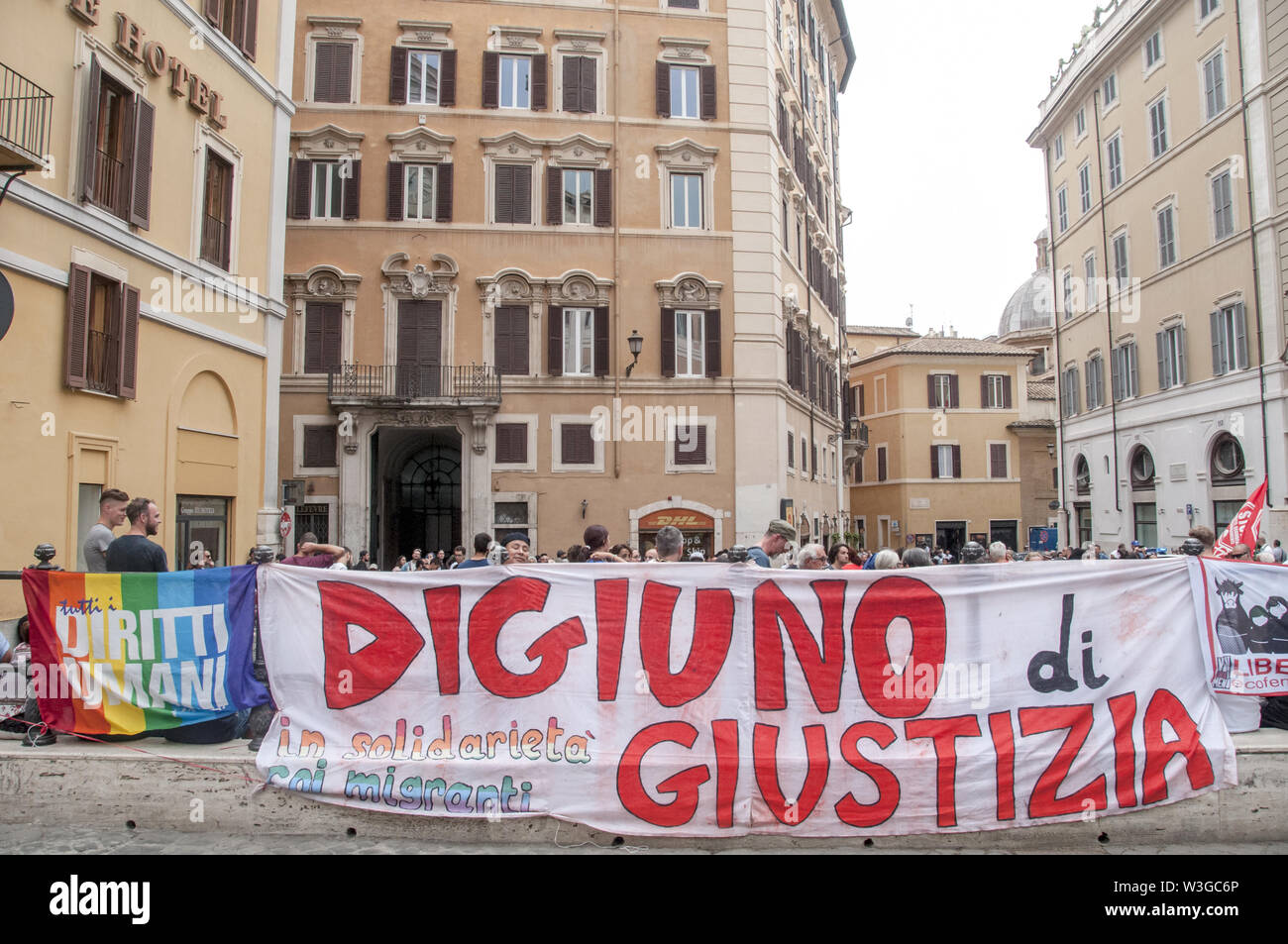 Rome, Italy. 15th July, 2019. Sit-in in front of the Chamber of Deputies (Montecitorio) against the Security Bis Decree organized by the Network Restiamo Umani. This morning a disproportionate number of police forces evacuated a former occupied school in the Primavalle district where about 300 people lived, including many children and former occupants, and the realities that had opposed the eviction this morning returned to Montecitorio in the afternoon. The parliamentarians Nicola Fratoianni and Riccardo Magi are also in the streets. Credit: Patrizia Cortellessa/Pacific Press/Alamy Live News Stock Photo