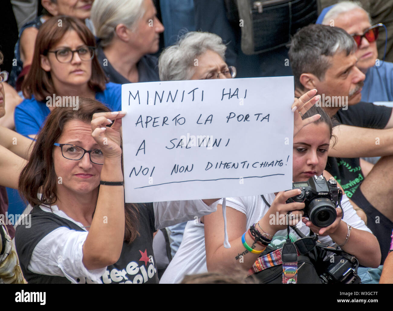 Rome, Italy. 15th July, 2019. Sit-in in front of the Chamber of Deputies (Montecitorio) against the Security Bis Decree organized by the Network Restiamo Umani. This morning a disproportionate number of police forces evacuated a former occupied school in the Primavalle district where about 300 people lived, including many children and former occupants, and the realities that had opposed the eviction this morning returned to Montecitorio in the afternoon. The parliamentarians Nicola Fratoianni and Riccardo Magi are also in the streets. Credit: Patrizia Cortellessa/Pacific Press/Alamy Live News Stock Photo