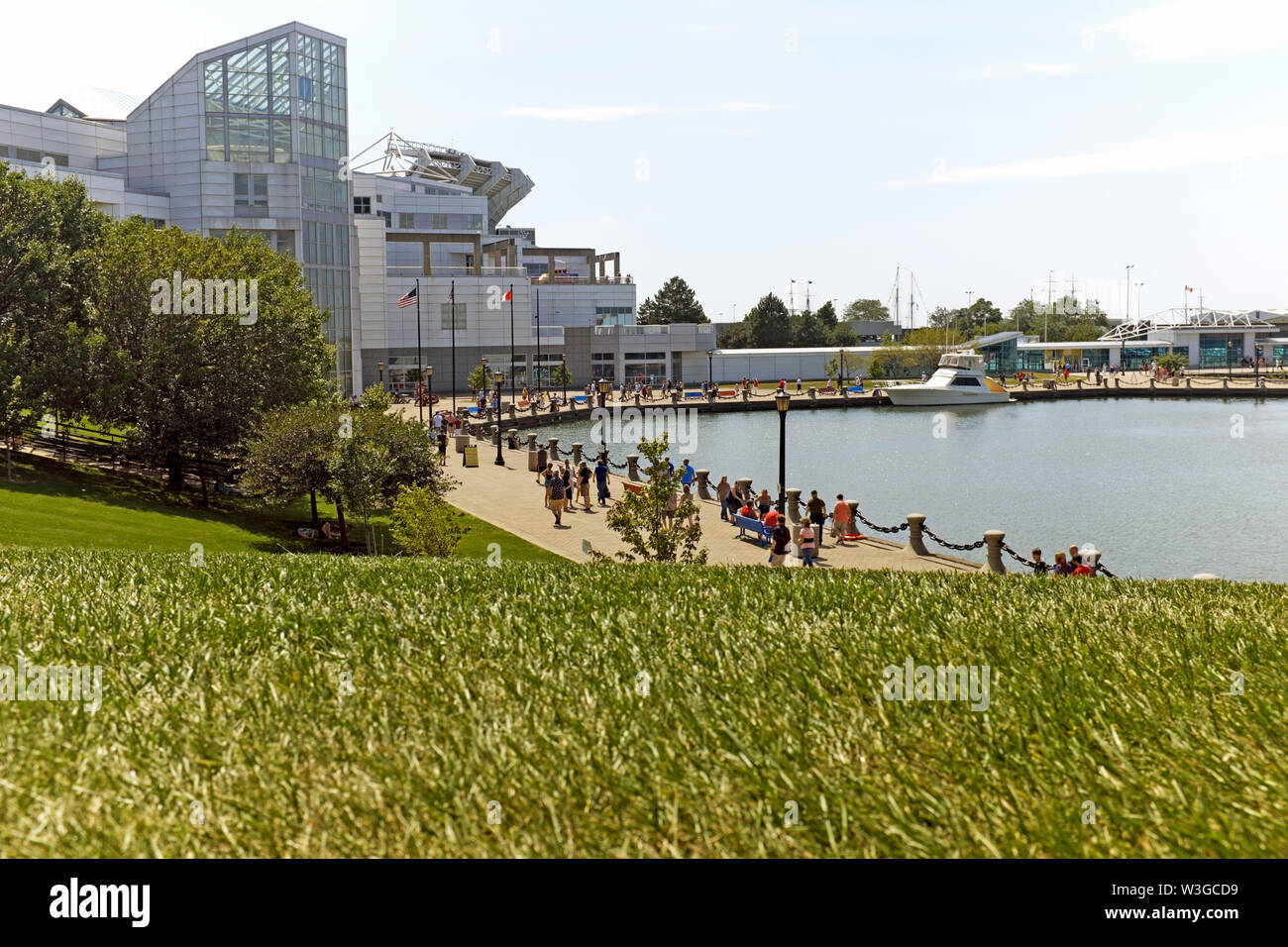 The Cleveland waterfront in the Northcoast Harbor has a popular promenade connecting major attractions, greenspace, and the lakefront. Stock Photo