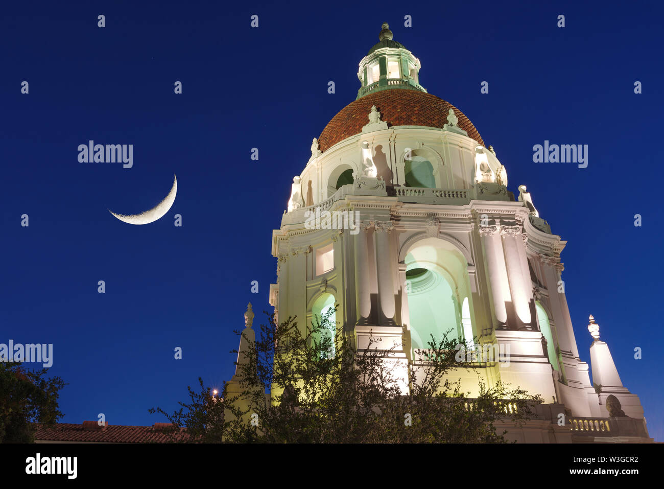 Pasadena City Hall main tower and dome and crescent moon against a twilight sky. Stock Photo