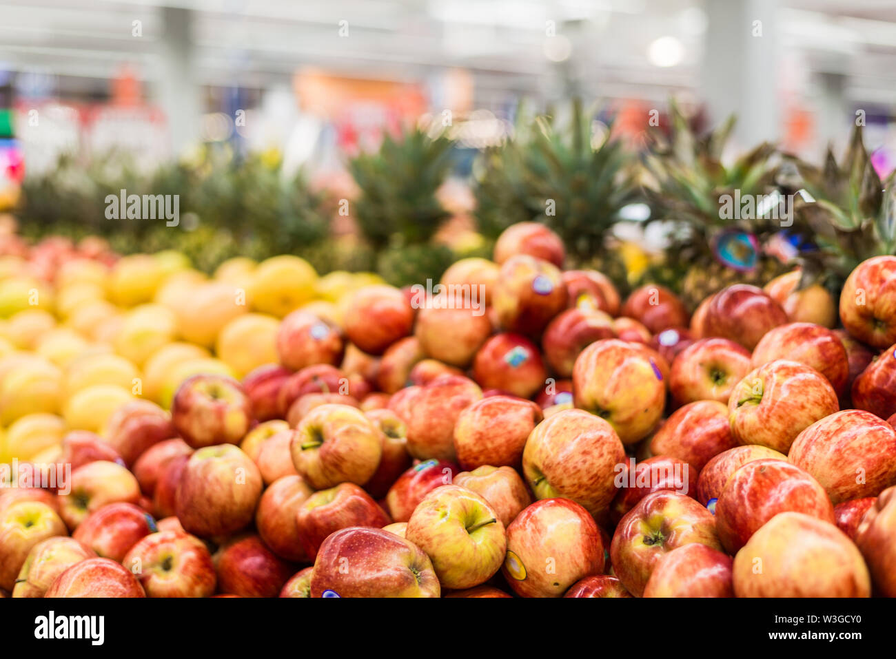 Apples and other fruit at a vegetable department in a supermarket Stock