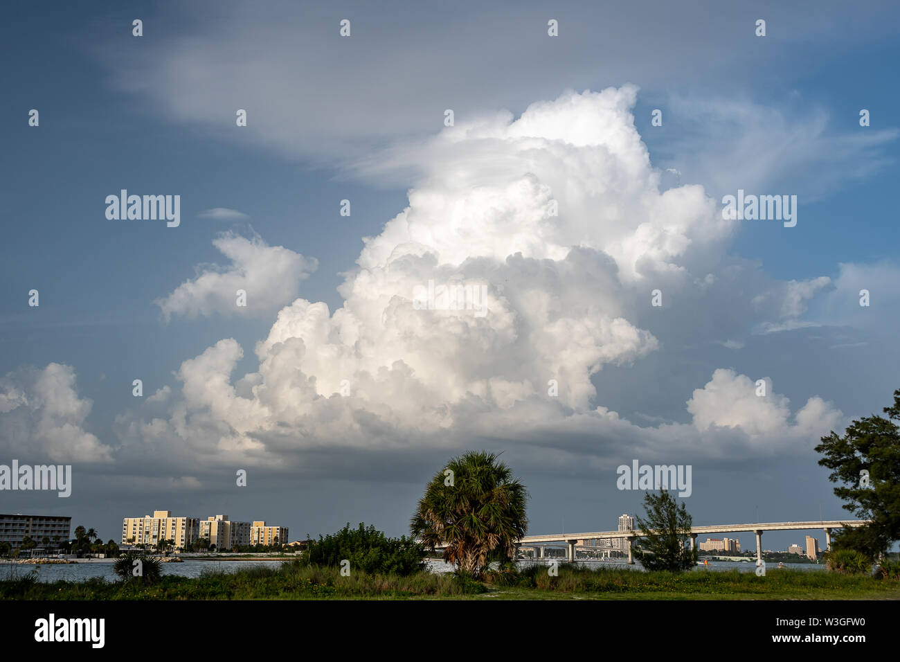 Clouds gather in the sky at the beach for the summer storms in Florida Stock Photo