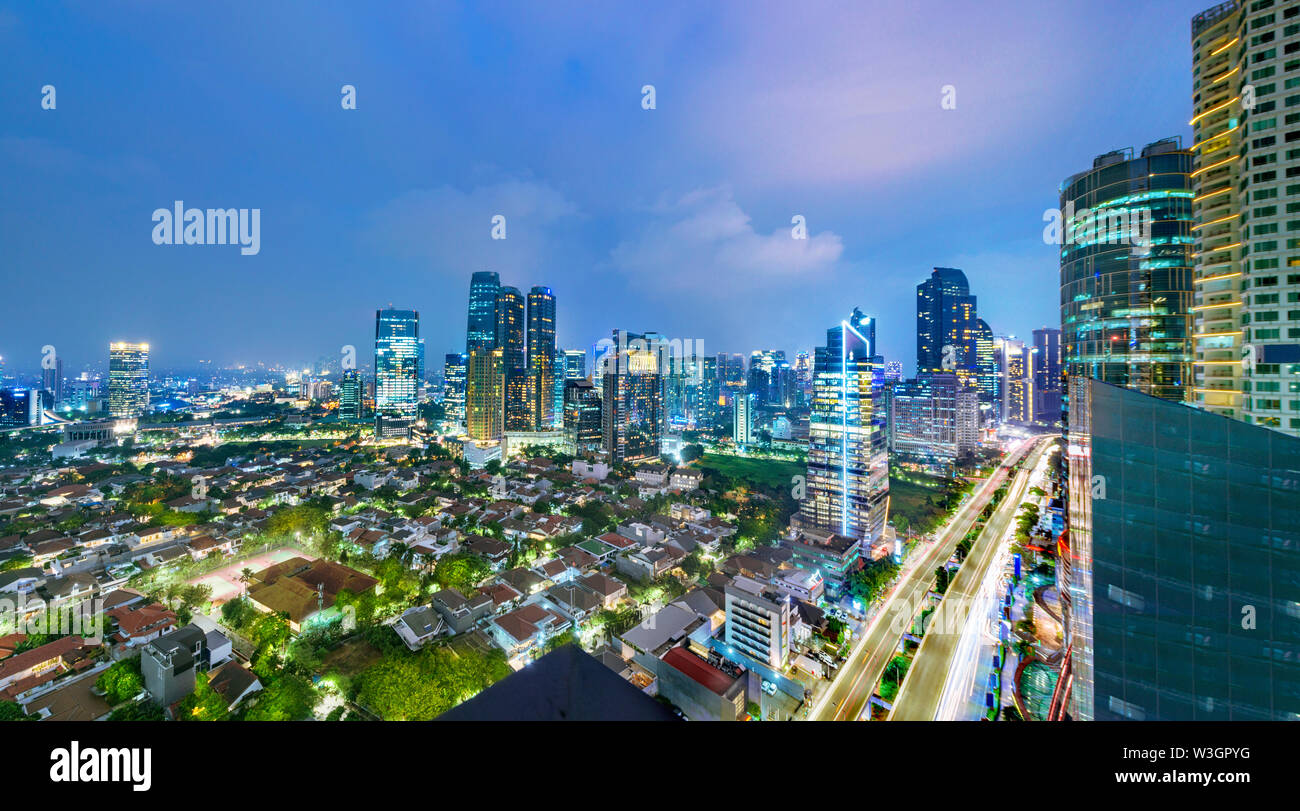 Panoramic Jakarta skyline with urban skyscrapers at night. Jakarta, Indonesia Stock Photo