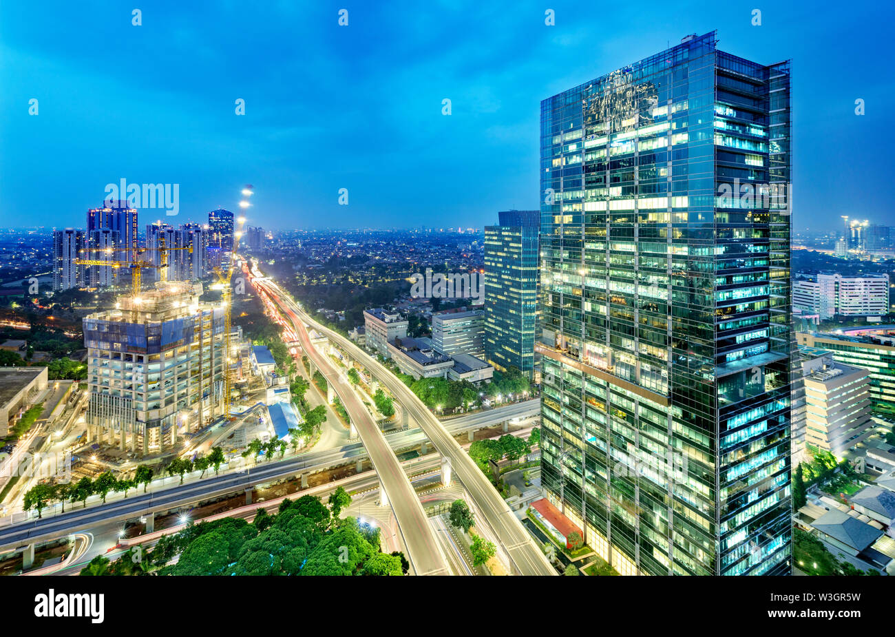 Jakarta city skyline with urban skyscrapers at night. Jakarta, Indonesia Stock Photo