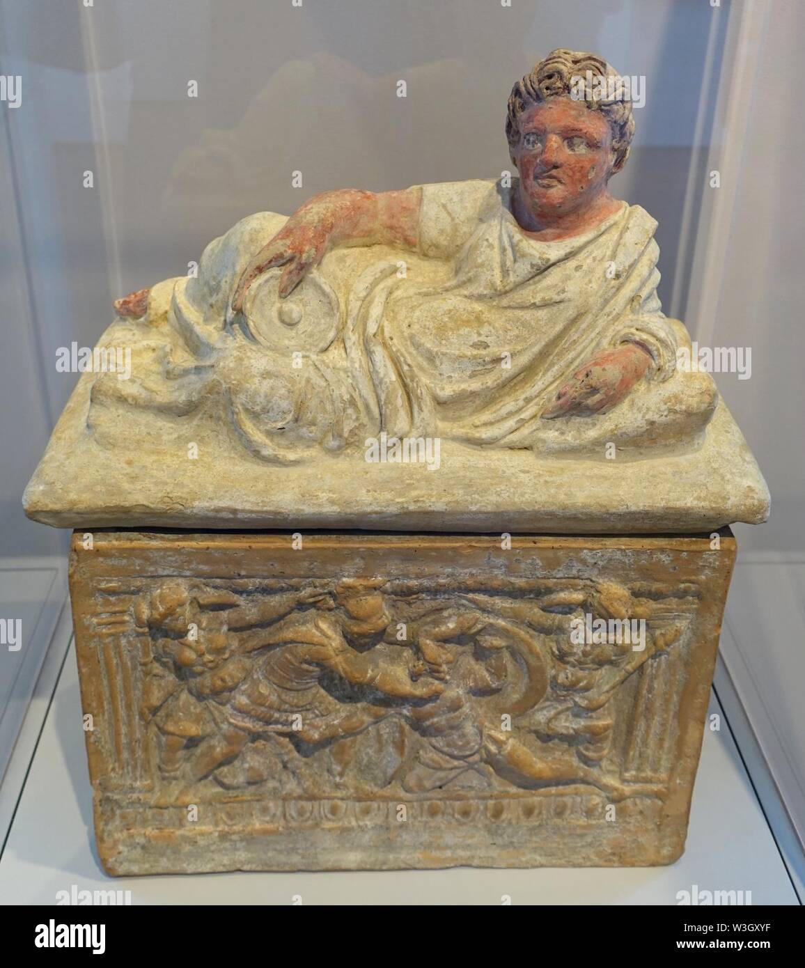 Cinerary Urn with Reclining Man and Battle Scene, Etruscan, probably from Clusium (Chiusi), first half of 2nd century BC, painted terracotta - Stock Photo