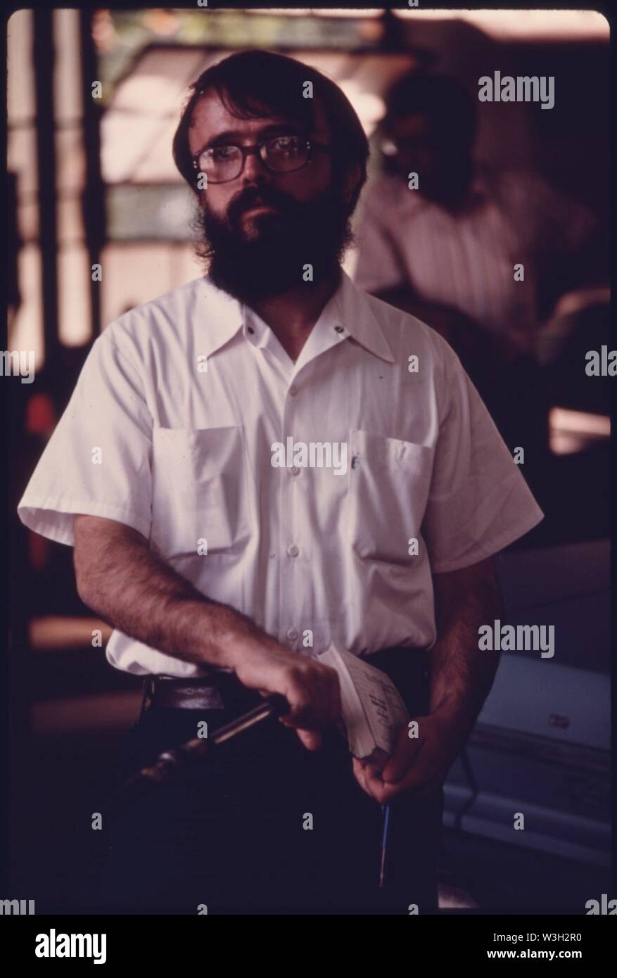 City Employee of an Auto Emission Inspection Station in Downtown Cincinnati, Ohio...091975