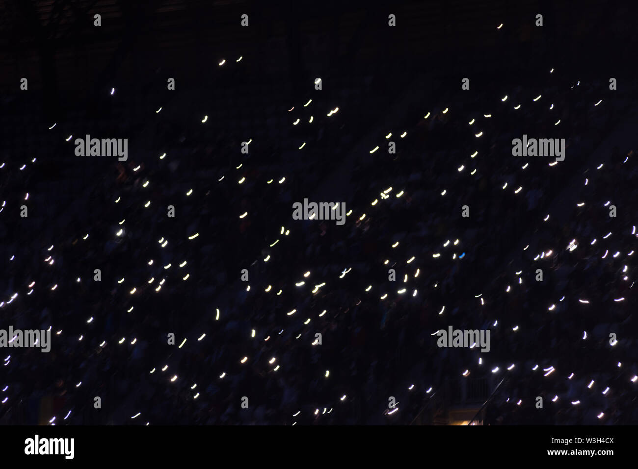 Hand holding phones in crowd hi-res stock photography and images - Alamy