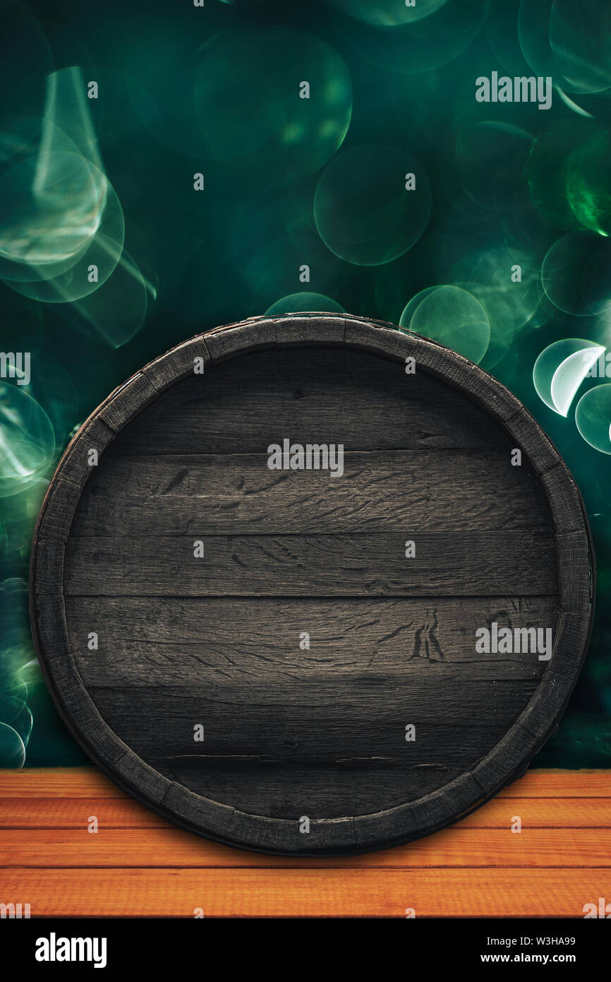 Old wooden barrel and wood table. Beautiful light bokeh background