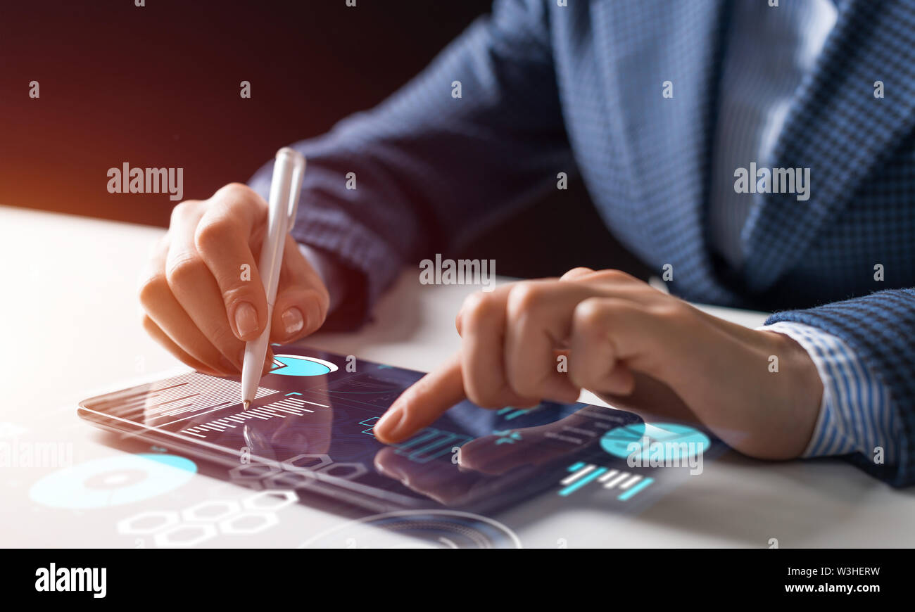 Businessman hands using tablet computer. Digital marketing media or financial diagrams in virtual screen. 3D chart floating above digital tablet compu Stock Photo