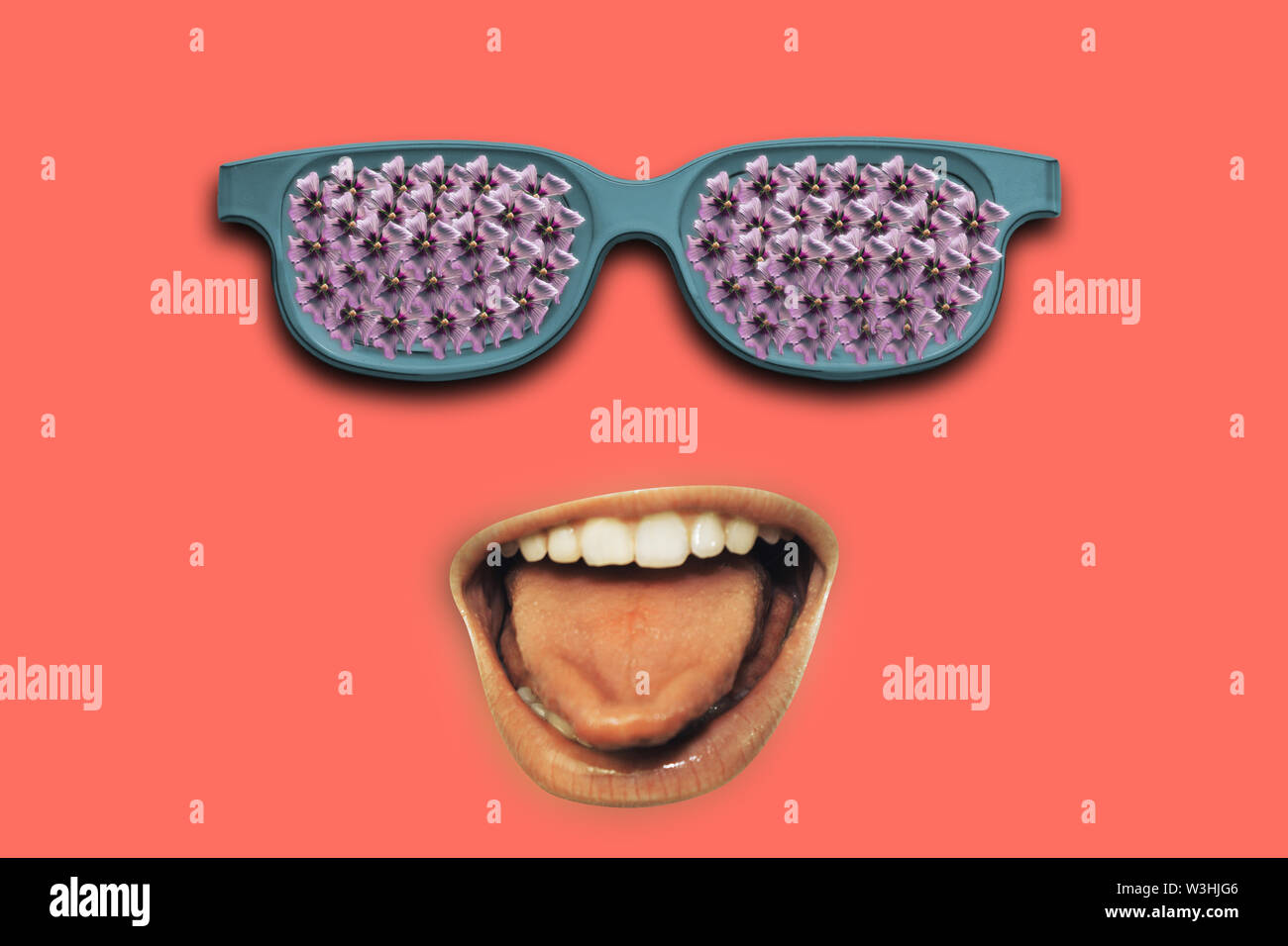 Open mouth shows a tongue with green sunglasses full purple flowers