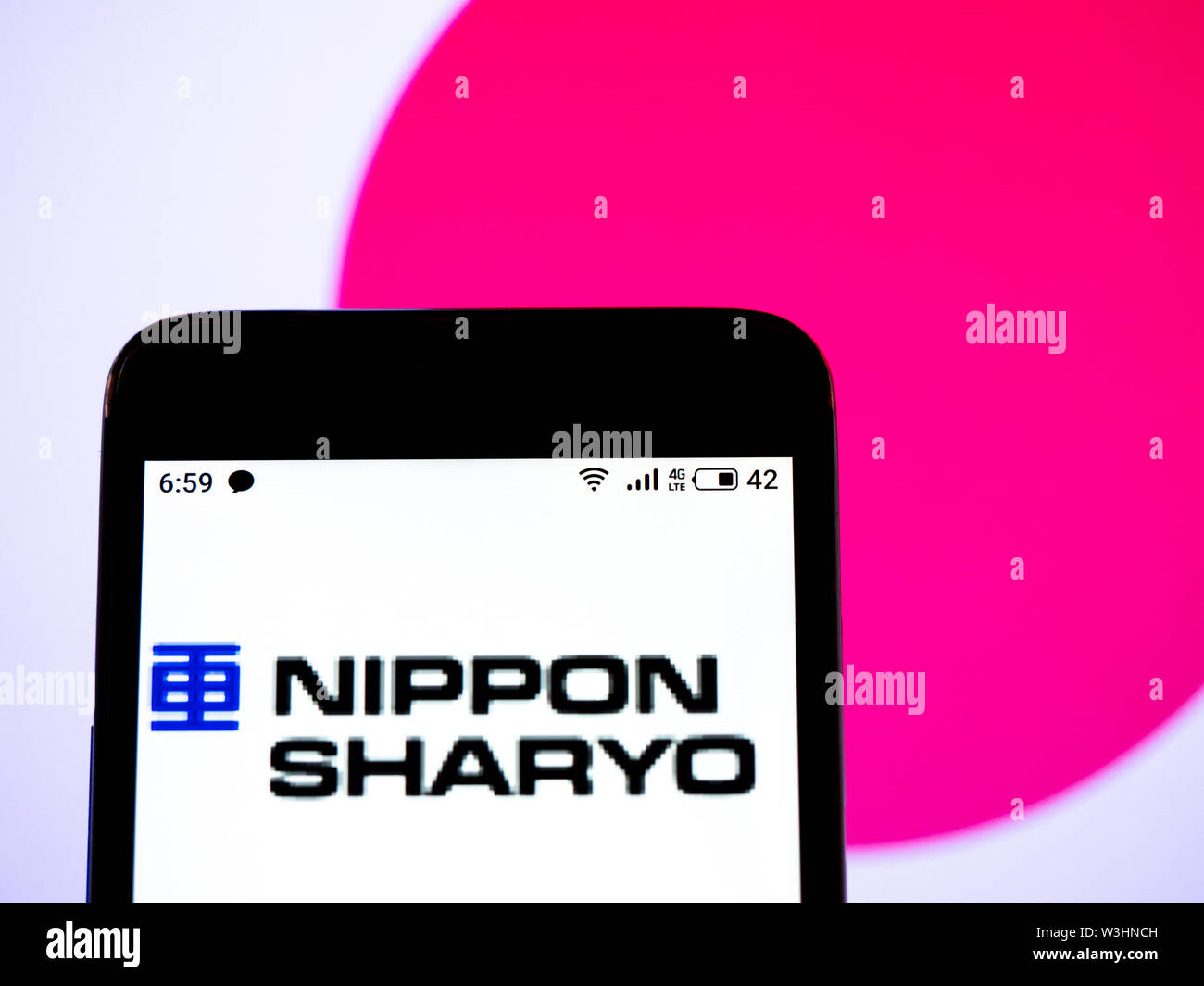 In this photo illustration the Nippon Sharyo, Ltd. logo is seen