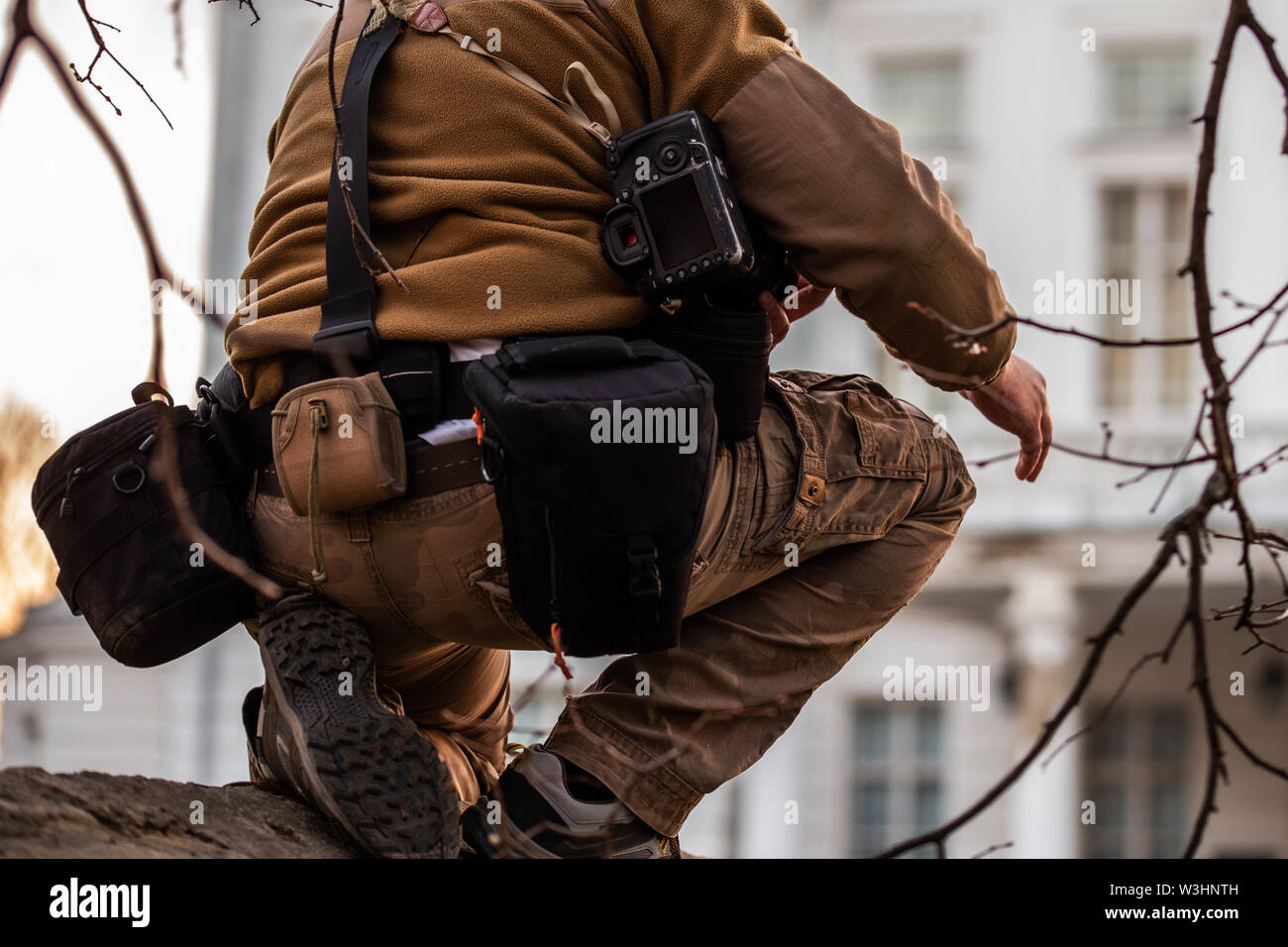 Professional extreme photographer belt pouch system gear in action. Stock Photo