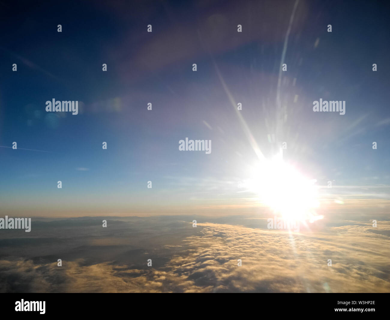 Aerial view from aircraft of sunset and clouds Stock Photo