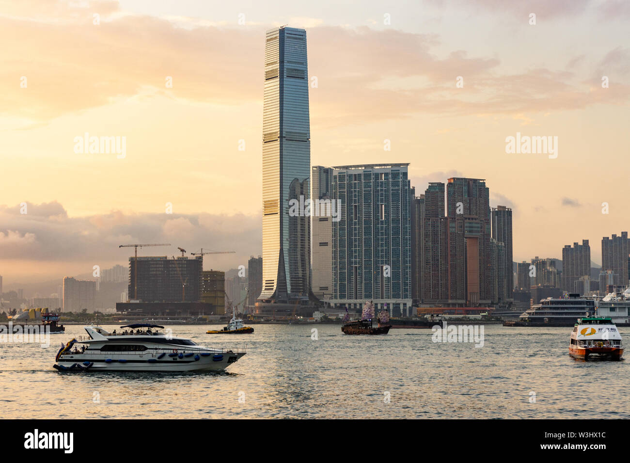 ICC and Victoria Harbour at sunset in Hong Kong Stock Photo