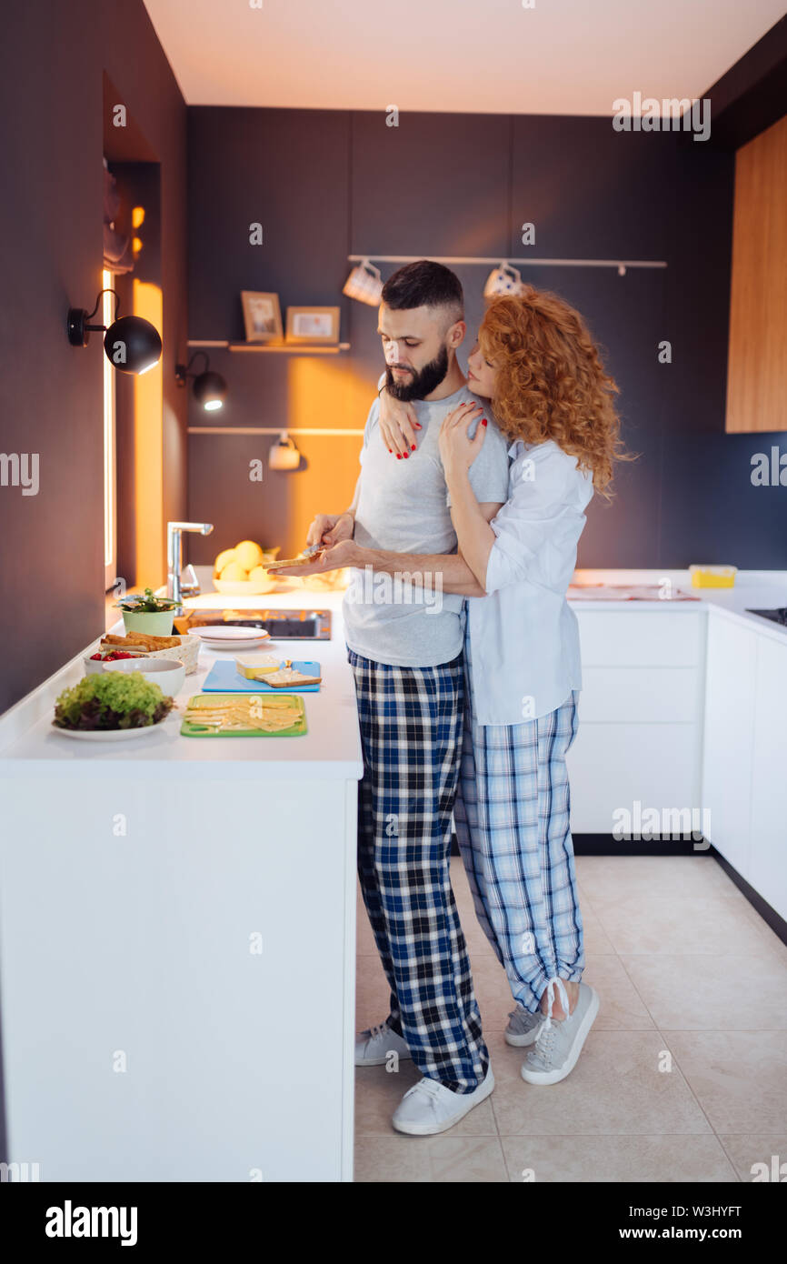 Wife hugging husband from behind hi-res stock photography and images ...