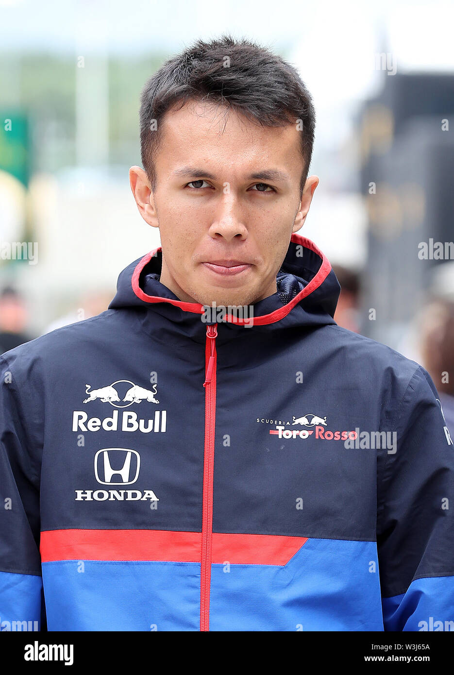 Toro Rosso driver Alexander Albon walks through the paddock before the British Grand Prix at Silverstone, Towcester. PRESS ASSOCIATION Photo. Picture date: Sunday July 14, 2019. See PA story AUTO British. Photo credit should read: Martin Rickett/PA Wire. Stock Photo