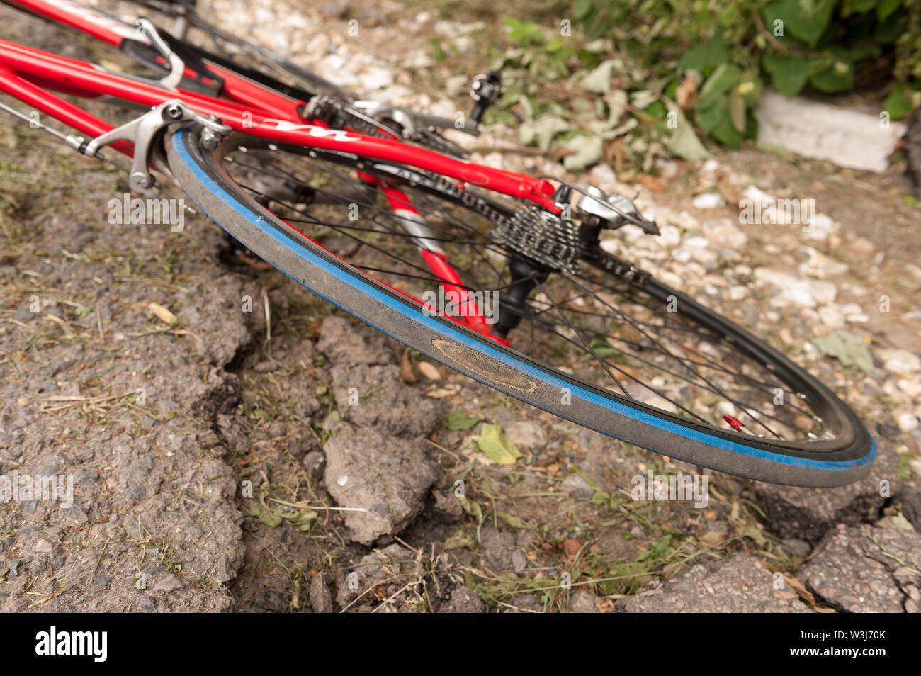 Damage caused by smashed broken derailleur causing wheel to lock and jam due to poor potholed